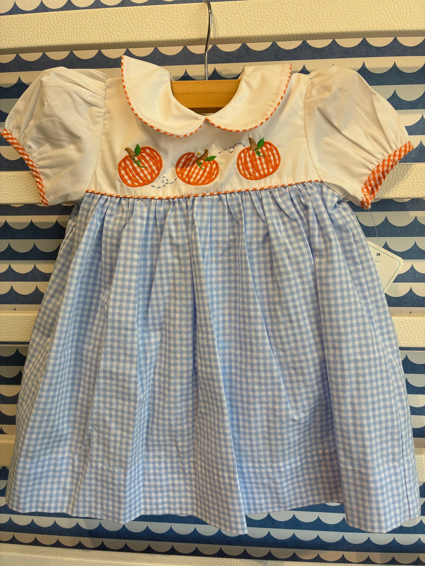 Dress with pumpkin appliqué